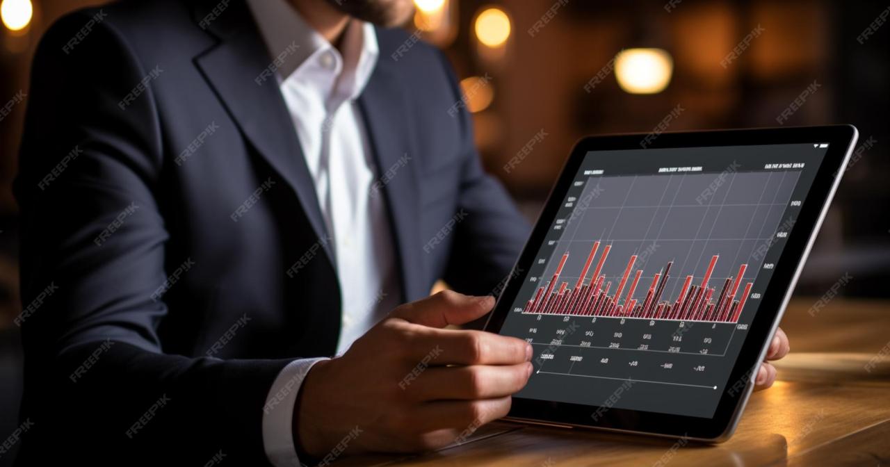Premium AI Image | A businessman showing bar graph on iPad Generative AI